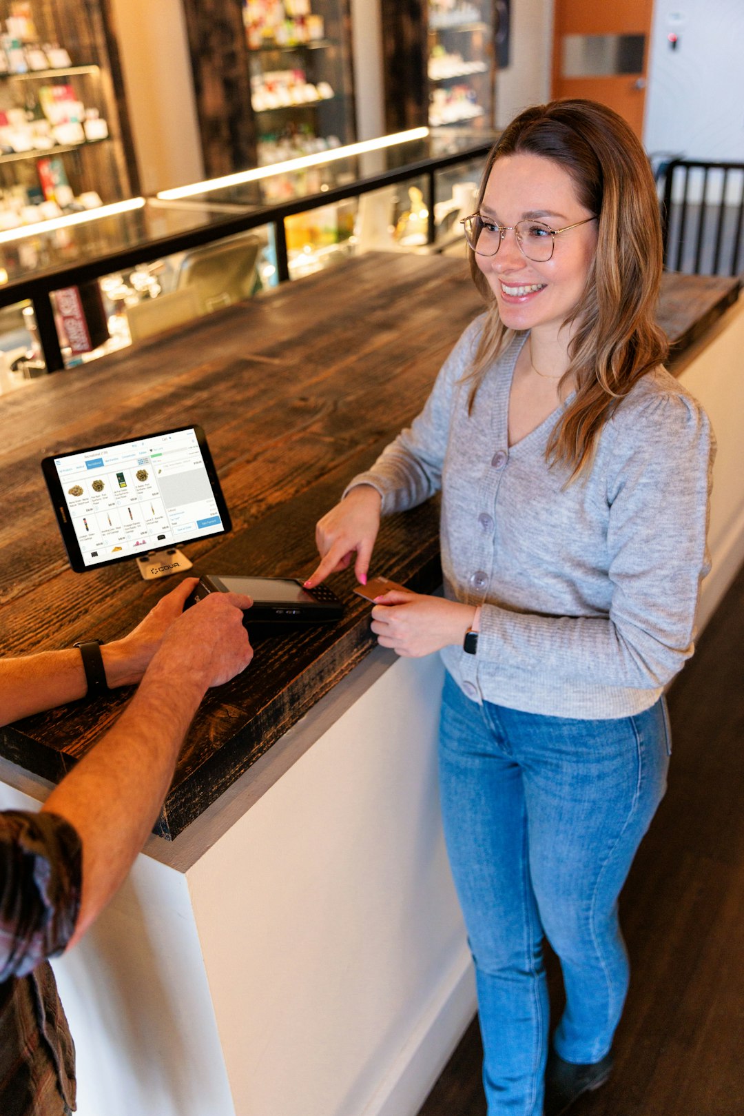 a man and a woman standing at a counter